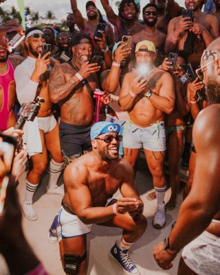 Vibrant crowd enjoying the Winter Party Festival in Miami Beach, celebrating electronic music and co.