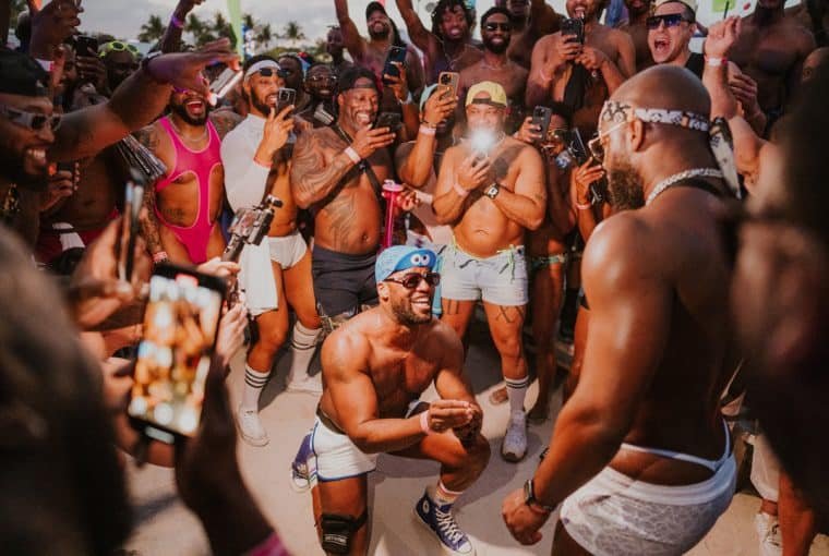Vibrant crowd enjoying the Winter Party Festival in Miami Beach, celebrating electronic music and co.